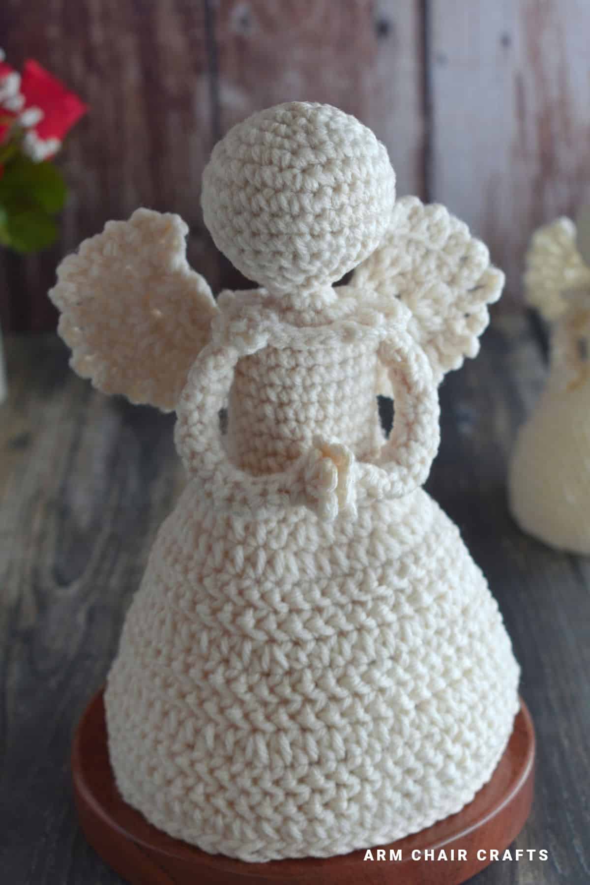 Crochet angel holding hands.