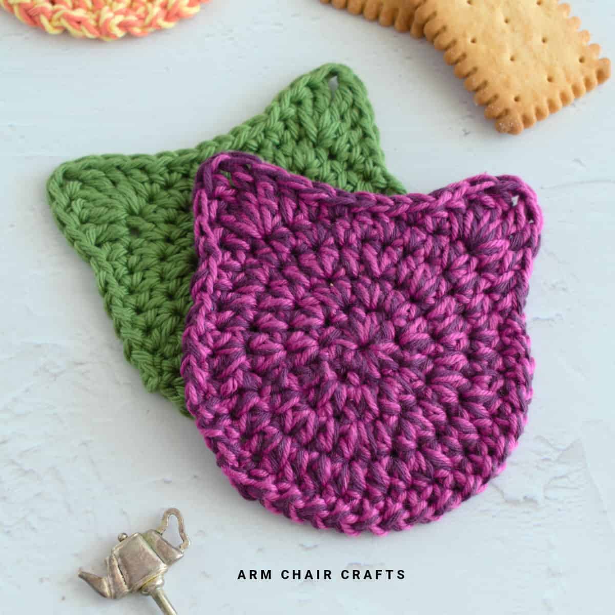 Close up image of cat crochet coasters.