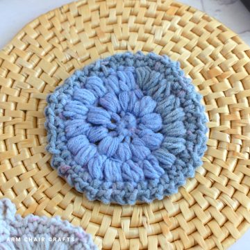 Crochet scrubby on a mat.