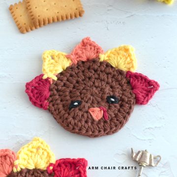 Close up image of a turkey crochet coaster.