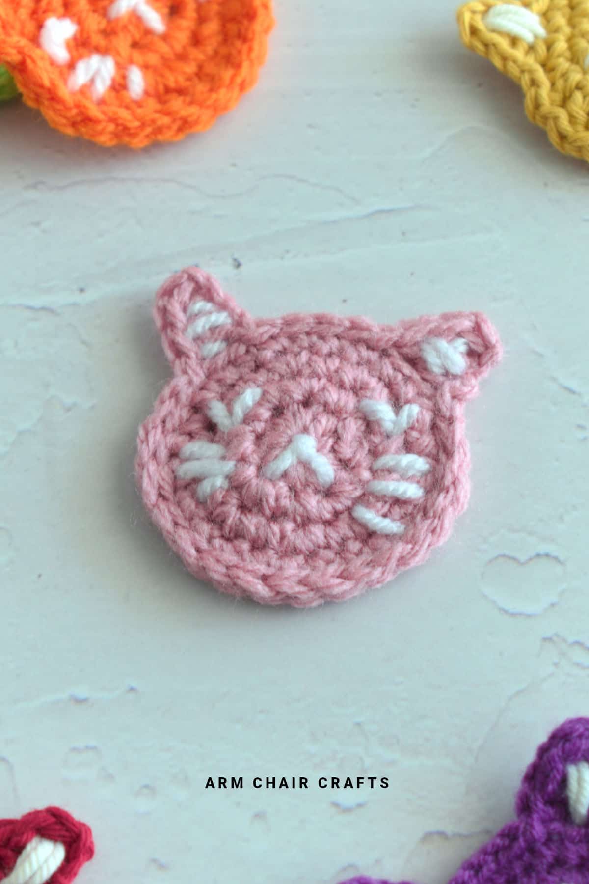 Pink crochet cat applique.