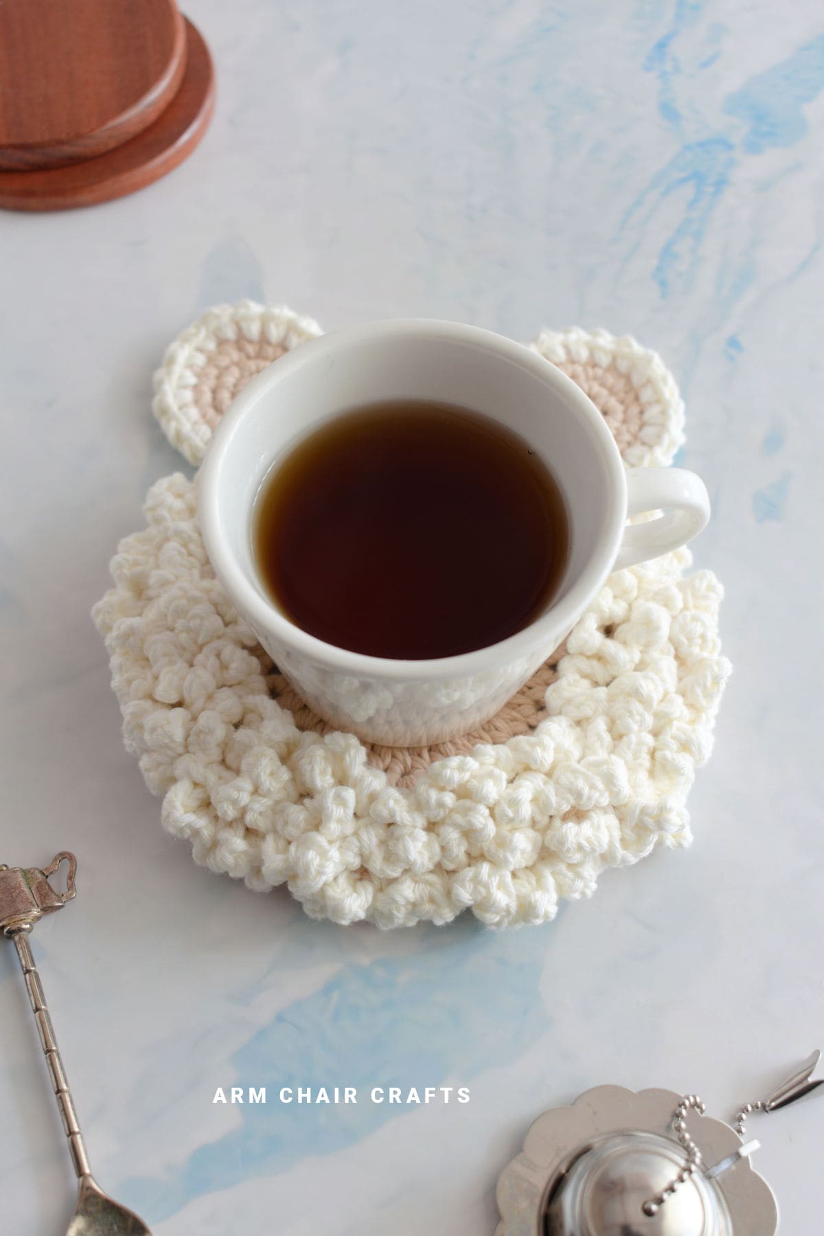 Crochet coaster with a cup of tea.