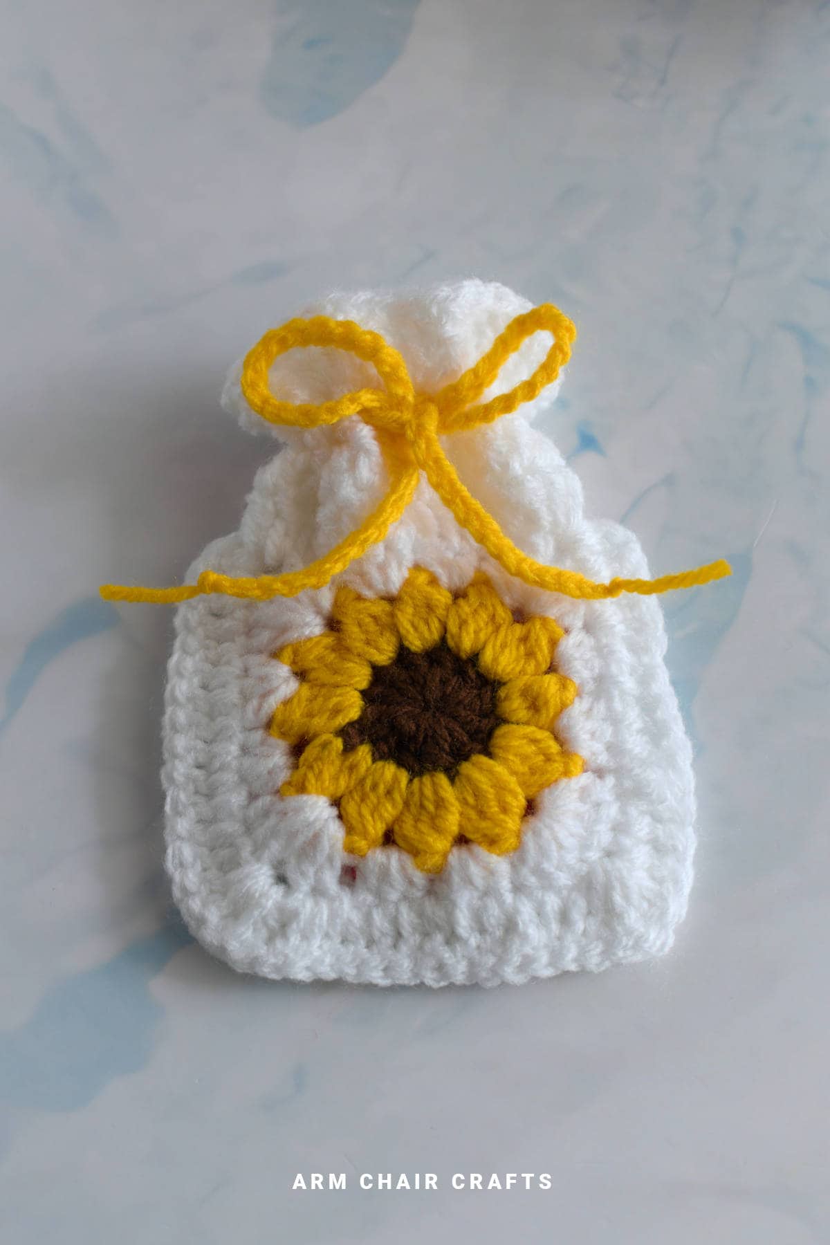 Yellow sunflower crochet pouch.
