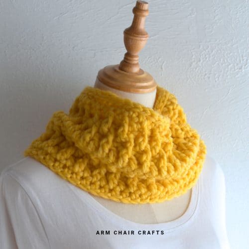 Close up image of a crochet cowl.