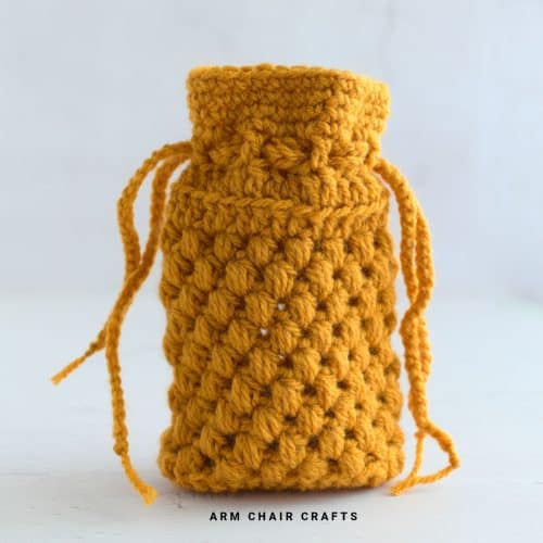 Brown crochet drawstring pouch.