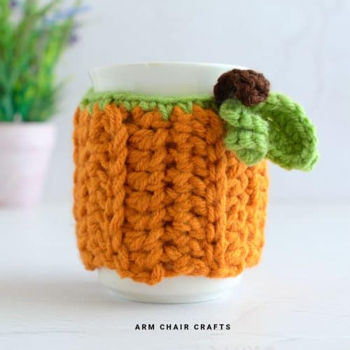 Close up image of a crochet mug cozy.