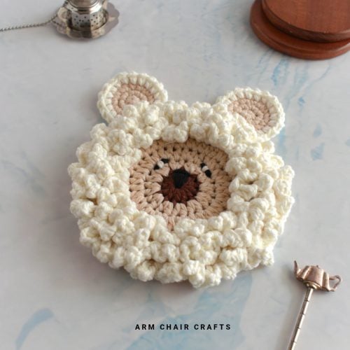Crochet sheep coaster.