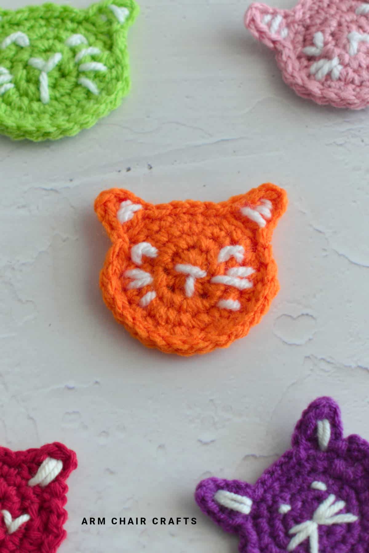 Orange crochet cat face.