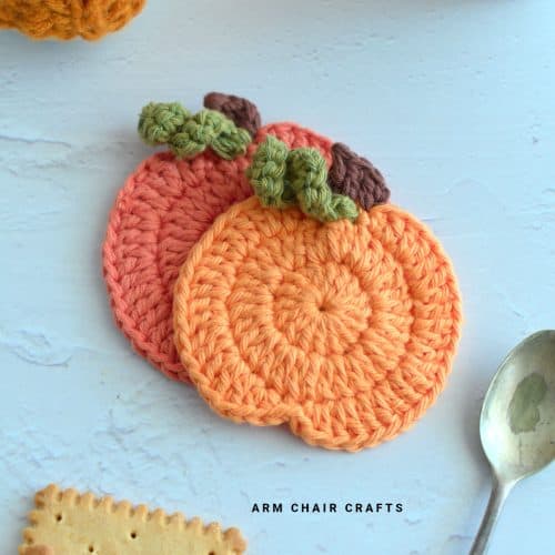 Close up image of crochet pumpkin coasters.