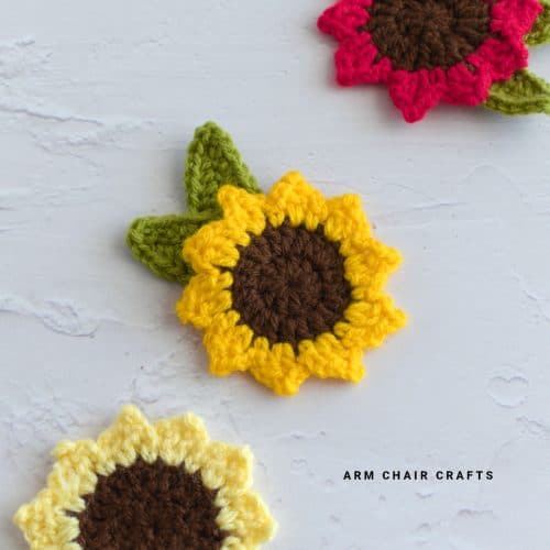 Close up image of a crochet sunflower applique.