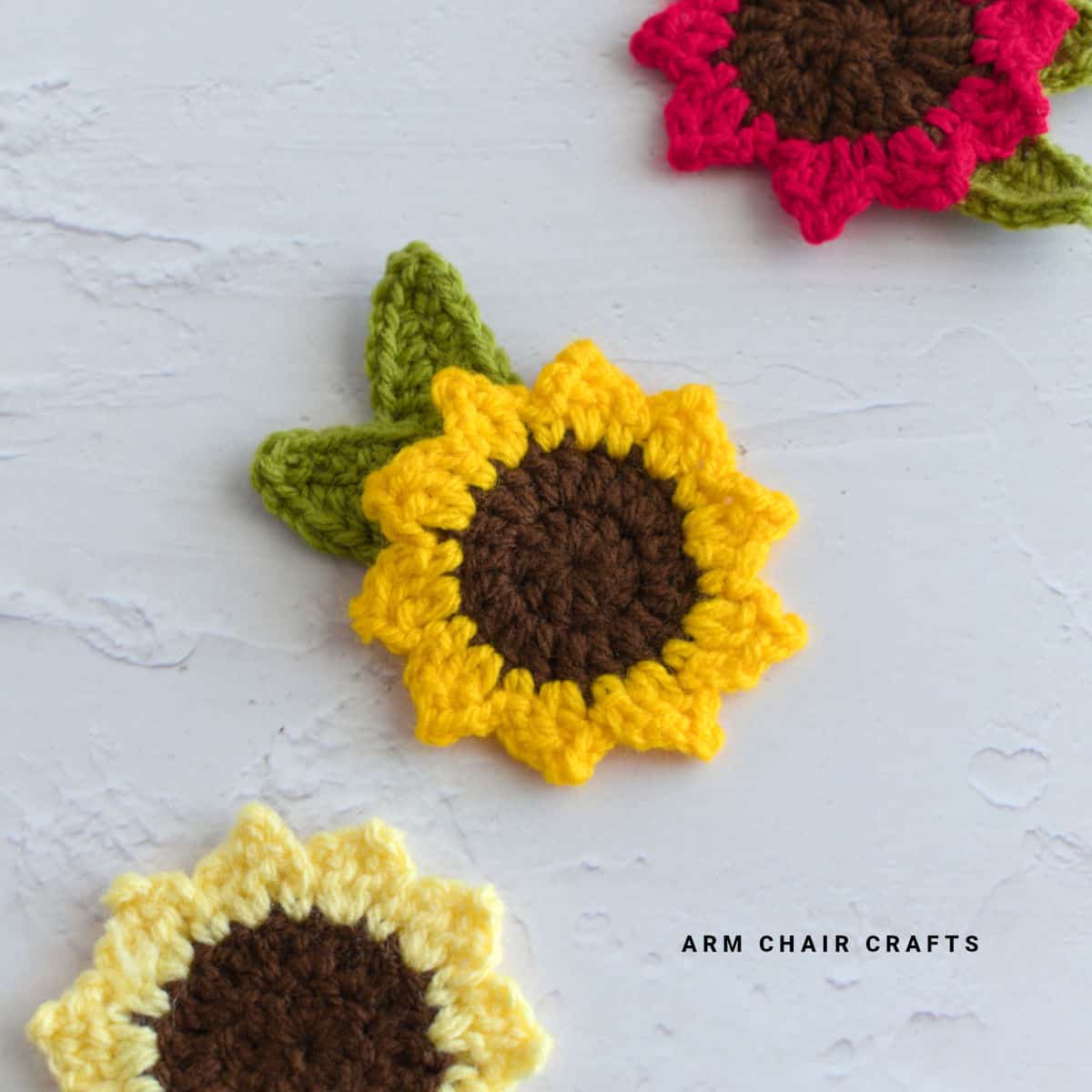 Close up image of a crochet sunflower applique.