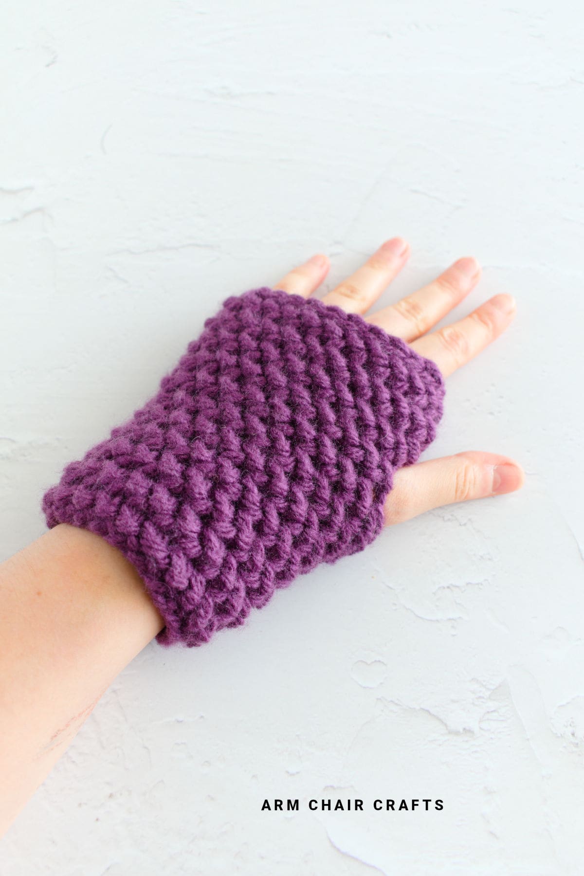 Purple herringbone crochet gloves.